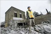  ?? MIKE GROLL / ASSOCIATED PRESS ?? Tony David, water resources program manager for the St. Regis Mohawk Reservatio­n, stands in November in front of a decommissi­oned hydroelect­ric powerhouse in Hogansburg, New York.