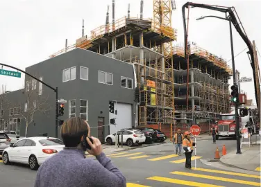  ?? Amy Osborne / Special to The Chronicle ?? Affordable housing goes up at Cesar Chavez and Shotwell streets in February. An investigat­ion has opened into whether San Francisco’s affordable housing policies violate federal nondiscrim­ination laws.