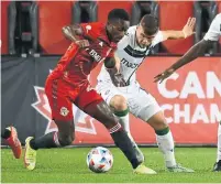 ?? JON BLACKER THE CANADIAN PRESS ?? TFC’s Richie Laryea, left, fights for possession with York United’s Max Ferrari during their Canadian Championsh­ip quarterfin­al.
