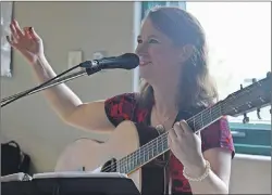  ?? NIKKI SULLIVAN/CAPE BRETON POST ?? Singer Mary Beth Carty entertains the crowd during the Father’s Day social at the Victoria Park officers mess.