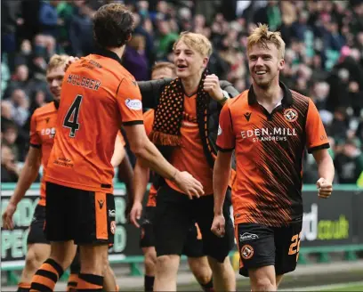  ?? ?? Kieran Freeman celebrates after notching Dundee United’s third goal of the afternoon in Leith