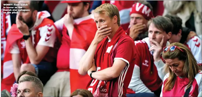  ?? Picture: Afp/getty ?? WORRY: Fans watch in horror as the Danish star collapses on the pitch