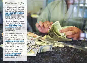  ?? AFP ?? A dealer counts US dollars at a currency exchange in Islamabad. Prime Minister Imran Khan is under pressure to generate external funding as the country faces the latest in a long line of financial blowouts.