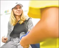  ?? Peter Hvizdak / Hearst Connecticu­t Media ?? Simona Halep, the No. 1 ranked player in the world, signs autographs Monday at the Connecticu­t Open.