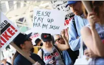  ?? MICHAEL M. SANTIAGO — GETTY IMAGES ?? One of the Writers Guild of American union demands is to guarantee weeks of work rather than working by the day, like a gig work.