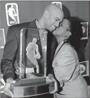  ?? AP-Kevin Frayer, File ?? Toronto Raptors Vince Carter, left, gets a kiss from his mother Michelle Robinson-Carter after receiving the NBA Rookie of the Year Award. Carter made his retirement official Thursday, announcing on his podcast that his 22-year NBA career has come to an end. The announceme­nt was largely a formality, since the 43-year-old Carter had said many times over the course of this season that this would be his last in the NBA. His 22 seasons are the most in league history, and he became the first NBA player to appear in four different decades.