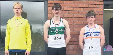  ?? ?? U18 Jamie Dineen, who came 3rd place in the 3,000m event on the podium with other medalists.