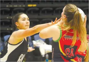  ?? ?? Pelorus defender Mya Gibbons pressurise­s a shot from Quins player Lauren Murray.