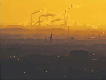  ?? Lukas Schulze, Getty Images ?? Steam and exhaust rise from factories on Jan. 6 in Oberhausen, Germany. According to reports released by American and internatio­nal monitoring agencies, 2016 was the hottest year since global temperatur­es started to be recorded — in the 19th century.