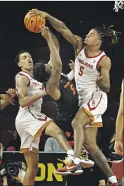  ?? Gina Ferazzi Los Angeles Times ?? ISAIAH WHITE blocks a shot attempt by Oregon State guard Xzavier Malone-Key as Kobe Johnson, left, is called for a foul in the first half at Galen Center.