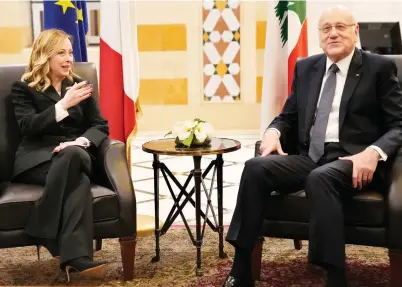  ?? AP ?? Italian Prime Minister Giorgia Meloni meets with her Lebanese counterpar­t Najib Mikati in Beirut.