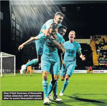 ??  ?? Elias Fritjof Sorensen of Newcastle United celebrates with teammates after he scores Newcastle’s second