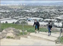  ??  ?? The 282 steps of the Culver City Stairs are said to range from 3 to 20 inches in height, making them a fun challenge. The payoff is the great view, such as of Century City in the background.