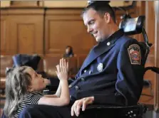  ?? Bob Donaldson/Post-Gazette ?? Matthew Onyshko looks at his daughter, Kendall, during Pittsburgh City Council meeting in 2014. a