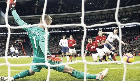  ?? AP ?? Manchester United goalkeeper David de Gea saves on a shot by Tottenham’s Harry Kane (right) during their English Premier League match at Wembley Stadium in London, England, yesterday.