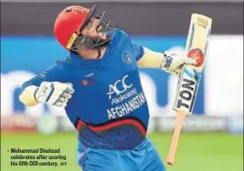  ?? AFP ?? Mohammad Shahzad celebrates after scoring his fifth ODI century.