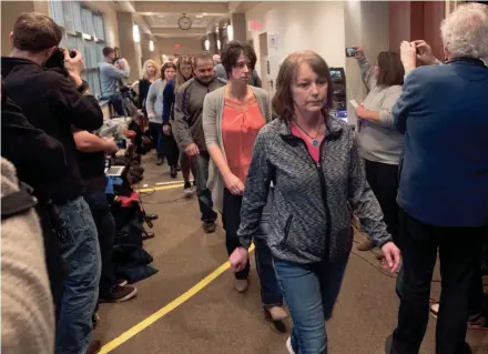  ?? MARK HOFFMAN / MILWAUKEE JOURNAL SENTINEL ?? Sue Allard, aunt of Jayme Closs, leads a group of relatives into the courtroom before Jake Thomas Patterson made an appearance Monday in Barron County Circuit Court in Barron. Patterson is charged with murder in the deaths of Denise and James Closs and with kidnapping Jayme, their 13-year-old daughter, who escaped after 88 days being held captive.