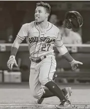  ?? Tom Szczerbows­ki / Getty Images ?? Astros second baseman Jose Altuve singles in the first inning as part of a three-hit night in the win over the Blue Jays. He raised his average to .342.