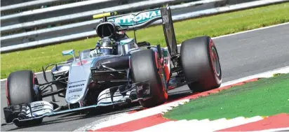  ??  ?? Mercedes driver Nico Rosberg of Germany steers his car during qualifying Photo: AP