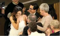  ?? (AP photo/ Chris Pizzello) ?? Michelle Yeoh, left, reacts in the audience with excitement Sunday as she accepts the award for best performanc­e by an actress in a leading role for “Everything Everywhere All at Once” at the Oscars at the Dolby Theatre in Los Angeles. Jamie Lee Curtis, from right, and Ke Huy Quan are seen in the audience.