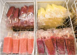  ?? APRIL GAMIZ/THE MORNING CALL ?? Fresh frozen fruit bars are available at Sundaes on Broadway in Wind Gap. Co-owner Jason Parker makes the bars in the shop out of fruit, water, sugar and stabilizer. He plans to have more flavors available as the weather warms up.