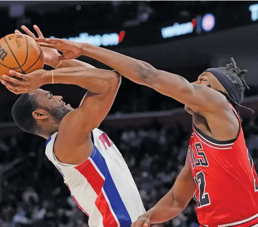  ?? CARLOS OSORIO/AP ?? Bulls guard Ayo Dosunmu (shown defending Pistons guard Alec Burks) is thrilled that fellow Chicagoan Patrick Beverley is his new teammate.