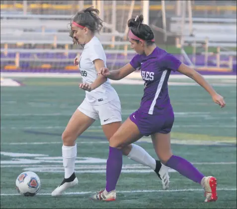  ?? RANDY MEYERS — FOR THE MORNING JOURNAL ?? Westlake’s Emilie Tobin and Meredith Coloian of Avon compete for the ball during the first half Oct. 22.