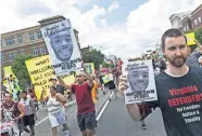  ?? SANGJIB MIN/RICHMOND TIMES-DISPATCH VIA AP, FILE] ?? Marchers for Marcus-David Peters shout in 2018 as they head to Richmond Police Headquarte­rs from VCU's Siegel Center in Richmond, Va. Around the U.S., protesters have been calling for prosecutor­s to take a second look at police killings of Black people, including Peters. [DANIEL