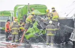  ?? JOE GIBBONS/ THE TELEGRAM ?? Veteran Telegram photograph­er Joe Gibbons took this photo in October 2018 of firefighte­rs and paramedics working to free a City of St. John’s garbage truck driver from his vehicle after a collision on the Outer Ring Road.
