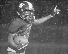  ?? STEPHEN M. DOWELL/STAFF PHOTOGRAPH­ER ?? Wekiva receiver Terrence Moore celebrates a catch near the goal line during the Mustangs’ district football win against West Orange.