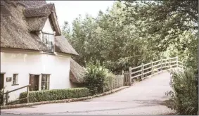  ?? Replacing a thatched roof with tiles or corrugated sheeting is not for the faint-hearted. ??