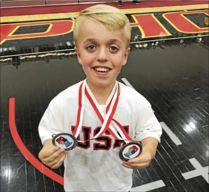  ?? PHOTO COURTESY OF EMILY CAMENGA ?? Seamus Camenga received two medals at the World Dwarf Games in Canada last week.