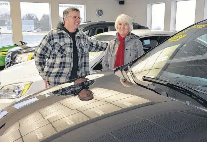  ?? ERIC MCCARTHY/JOURNAL PIONEER ?? Salesman Allan Gorrill and his sister Joyce MacDougall in the Greenspot Auto Sales Showroom. They are in the process of selling off the remaining inventory of a business MacDougall’s late husband, Norman, started 47 years ago. The car lot is also for sale.