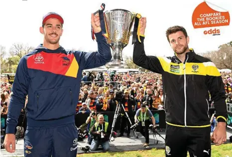  ?? PHOTO: QUINN ROONEY/GETTY ?? WHAT IT’S ALL ABOUT: Rival captains, Adelaide’s Taylor Walker (left) and Richmond’s Trent Cotchin, with the premiershi­p cup in Melbourne yesterday.