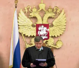  ?? —AP ?? A Russian Supreme Court official reads the verdict banning Jehovah’s Witnesses as an extremist organizati­on.