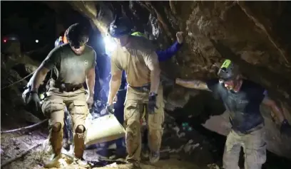  ?? — Reuters ?? Rescue personnel work at the Tham Luang cave complex in the northern province of Chiang Rai, Thailand , in this still image taken from a video obtained from social media.