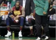  ?? CHARLES KRUPA — THE ASSOCIATED PRESS ?? Cleveland Cavaliers forward LeBron James sits on the bench during a timeout in the second half in Game 2 of the team’s NBA basketball Eastern Conference finals against the Boston Celtics, Tuesday in Boston.