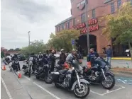  ?? STAFF PHOTO BY PATRICK FILBIN ?? Veterans taking part in a Wounded Warriors mental health workshop park their bikes out front of a Harley Davidson Shop in Dalton, Ga., before lunch on Tuesday.