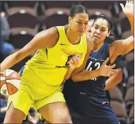  ?? Jessica Hill / Associated Press ?? The Dallas Wings’ Liz Cambage, left, drives against the Connecticu­t Sun’s Brionna Jones during a preseason game on May 8, 2018, in Uncasville.