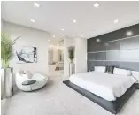  ??  ?? The master bedroom and ensuite have an integrated and flowing layout.