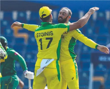  ?? ?? Australia's Glenn Maxwell (R) celebrates with teammate Marcus Stoinis during Twenty20 World Cup match. Pic: AFP