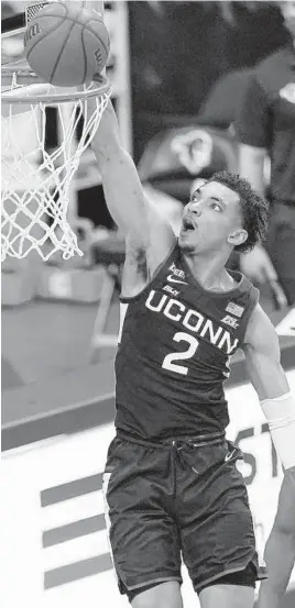 ?? KATHY WILLENS / AP MARYLAND VS. UCONN ?? UConn guard James Bouknight dunks during a game earlier this month. Bouknight leads the Huskies in scoring.
