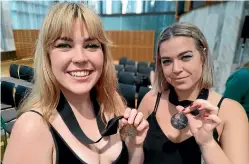  ?? NOPE SISTERS ?? Johanna, left, and Brittany Cosgrove, of Wellington social activist fashion initiative Nope Sisters, with their Local Hero medals.