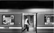  ??  ?? A worker cleans the subway before its departure in Stockholm