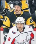  ?? AP PHOTO ?? Pittsburgh Penguins’ Sidney Crosby and Washington Capitals’ Alex Ovechkin keep a close eye on the action April 1 in Pittsburgh.