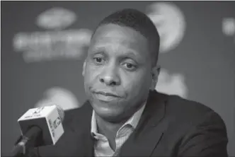  ?? The Associated Press ?? CASEY OUT: Toronto Raptors president Masai Ujiri listens during a news conference Friday after the firing of head coach Dwane Casey in Toronto.