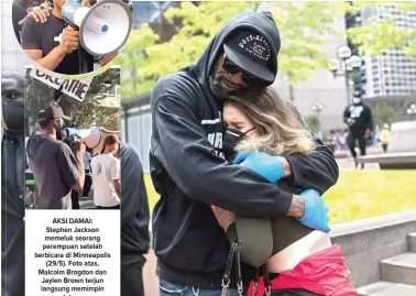  ?? STEPHEN MATUREN/GETTY IMAGES/AFP ?? AKSI DAMAI: Stephen Jackson memeluk seorang perempuan setelah berbicara di Minneapoli­s (29/5). Foto atas, Malcolm Brogdon dan Jaylen Brown terjun langsung memimpin unjuk rasa.