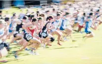  ??  ?? A field of more than 200 runners, including winner Gavin Sherry of Conard (No. 2002), take off from the start of the 2019 CIAC Boys State Open. Sherry finished the race in 15 minutes, 38 seconds.