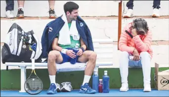  ?? ?? Serbian tennis player Novak Djokovic talks to his assistant Pepe Imaz during a training session at Puente Romano Tennis Club in Marbella, Spain, January 3, 2022. Picture taken January 3, 2022. KMJ-GTRES/Handout via REUTERS