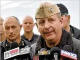  ?? TONY GIBERSON / PENSACOLA NEWS JOURNAL ?? Navy Capt. Tim Kinsella, commanding officer at Pensacola Naval Air Station, briefs members of the media following the shooting.